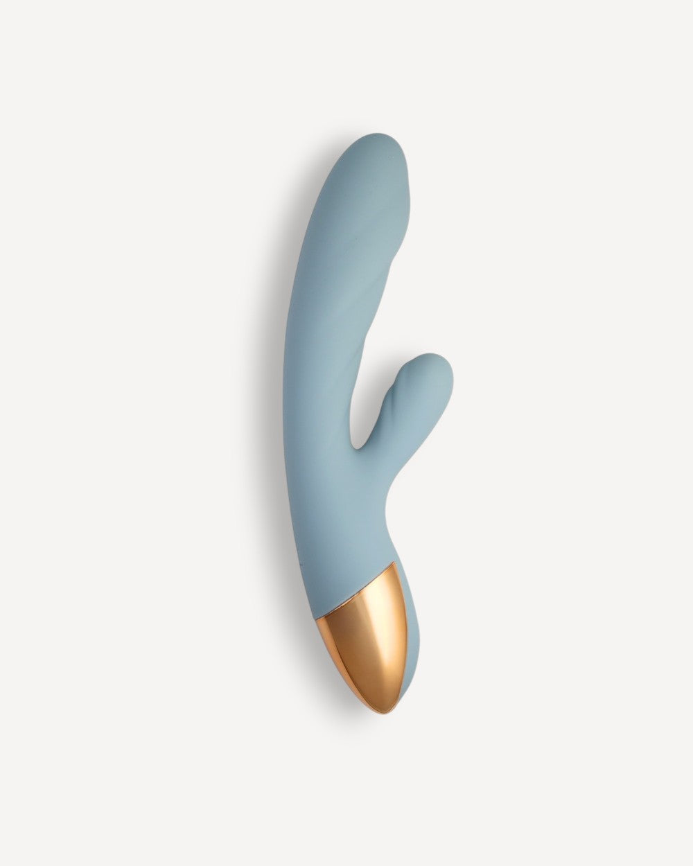Vibromasseur rabbit chauffant Nola de Solena bleu pour double stimulation du point G et du clitoris.